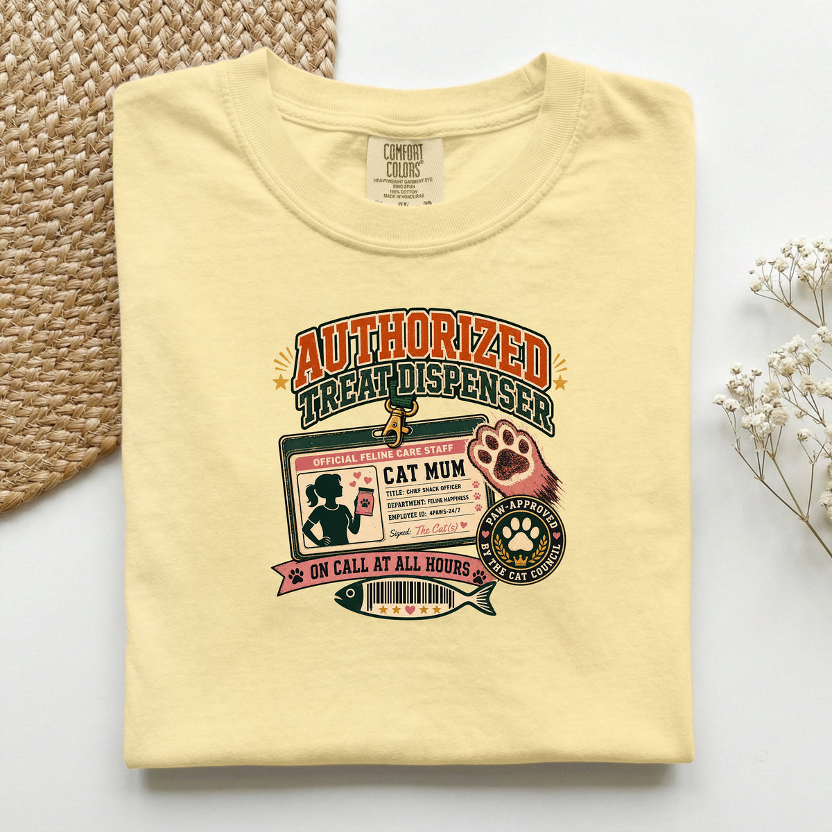 Authorized Treat Dispenser graphic tee in Butter, folded mockup