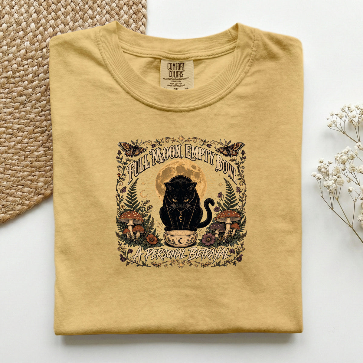 Full Moon Empty Bowl graphic tee in Mustard, folded flat lay