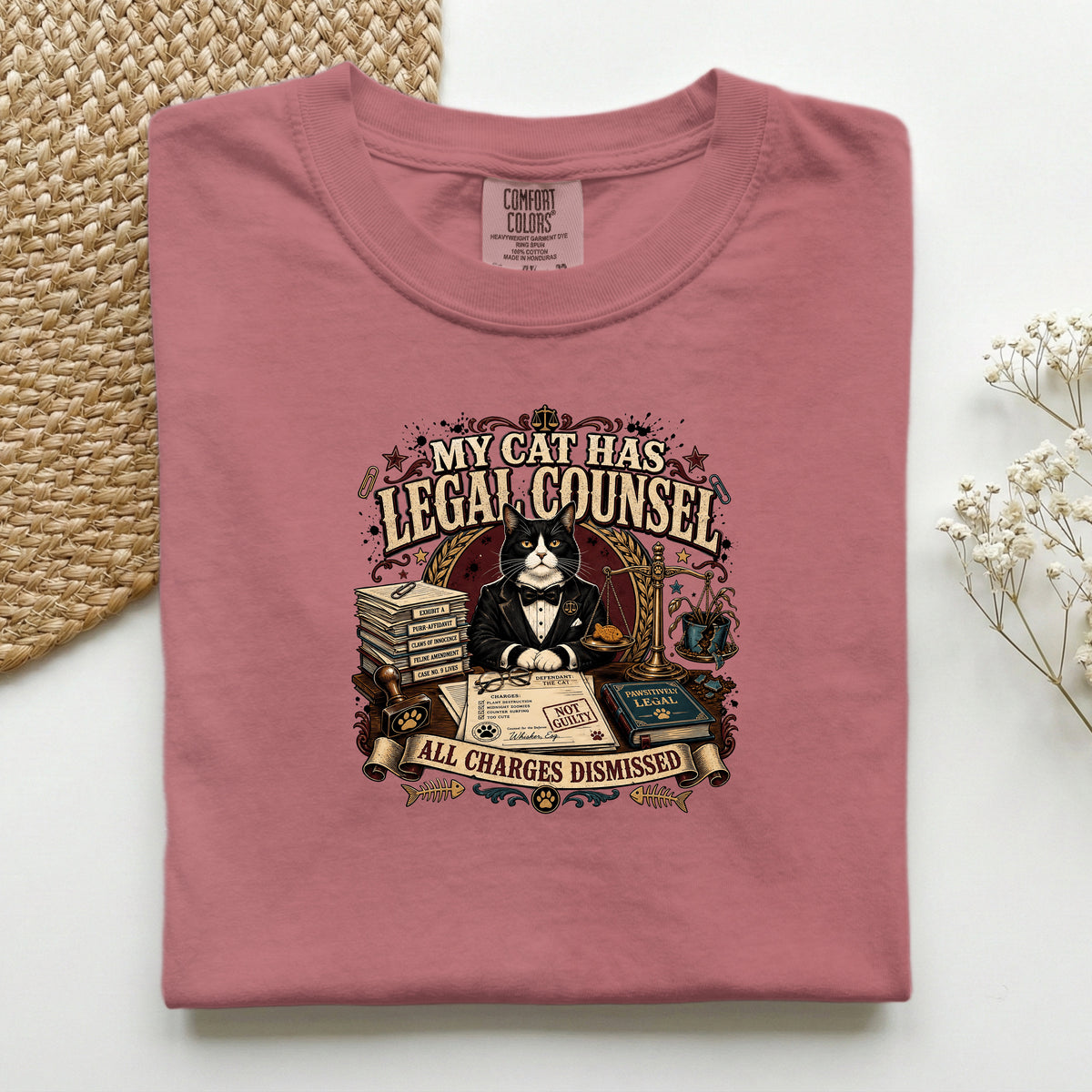 My Cat Has Legal Counsel graphic tee in Brick, folded mockup