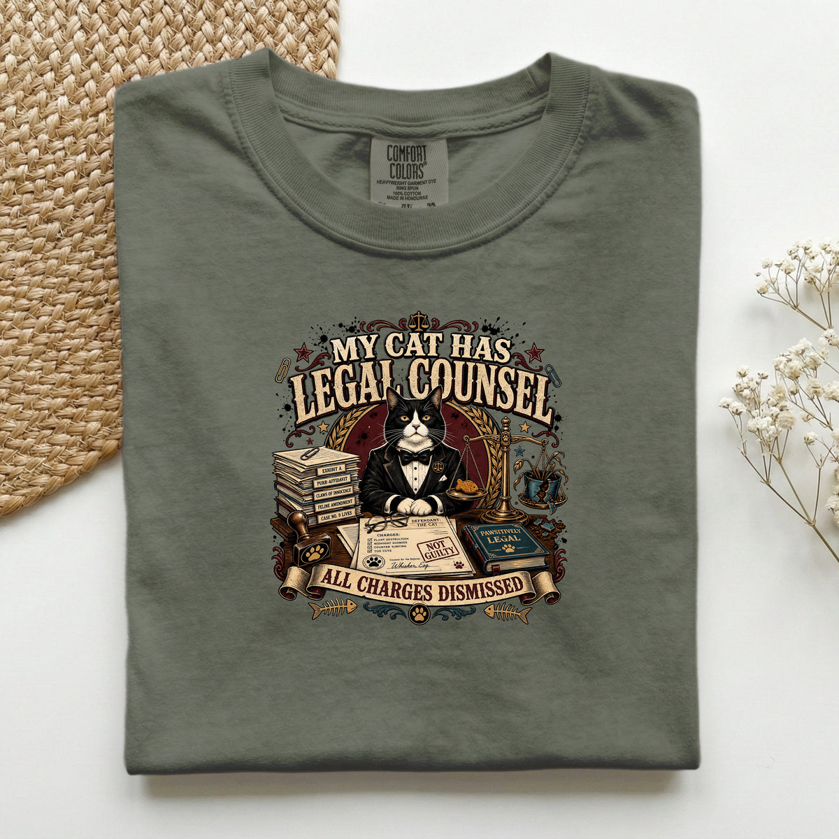 My Cat Has Legal Counsel graphic tee in Moss, folded mockup