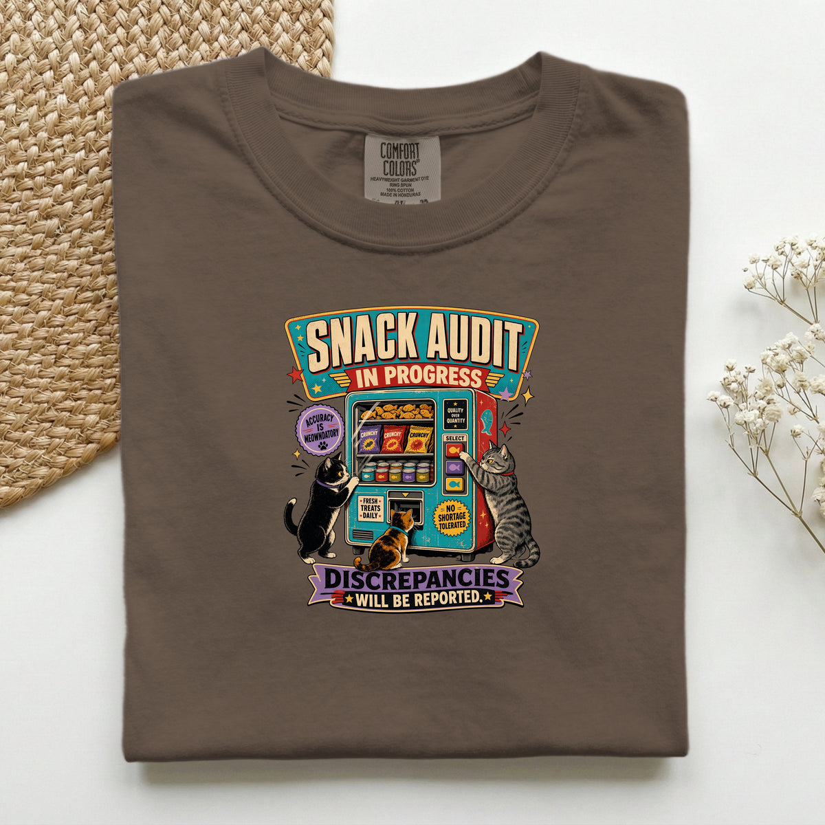 Snack Audit In Progress graphic tee in Espresso, folded mockup