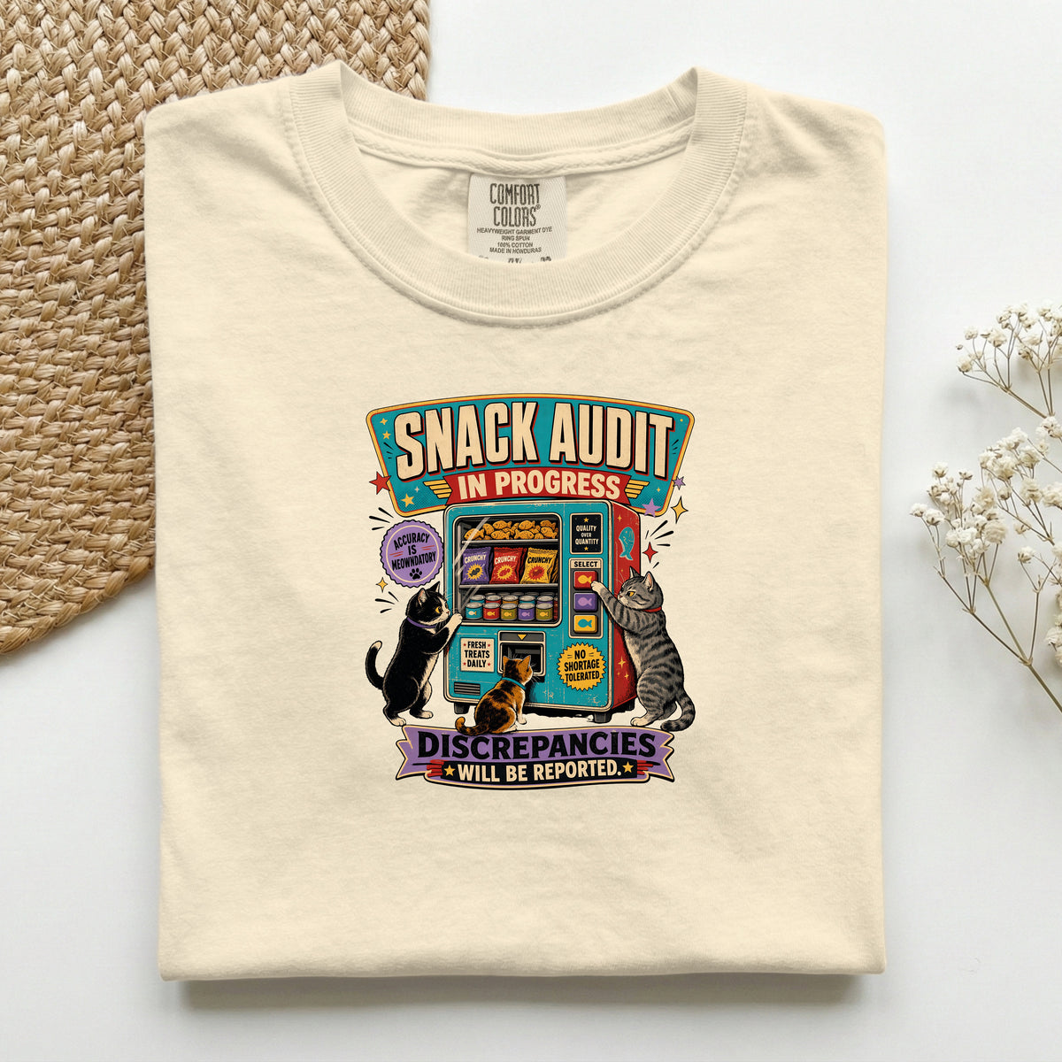 Snack Audit In Progress graphic tee in Ivory, folded mockup