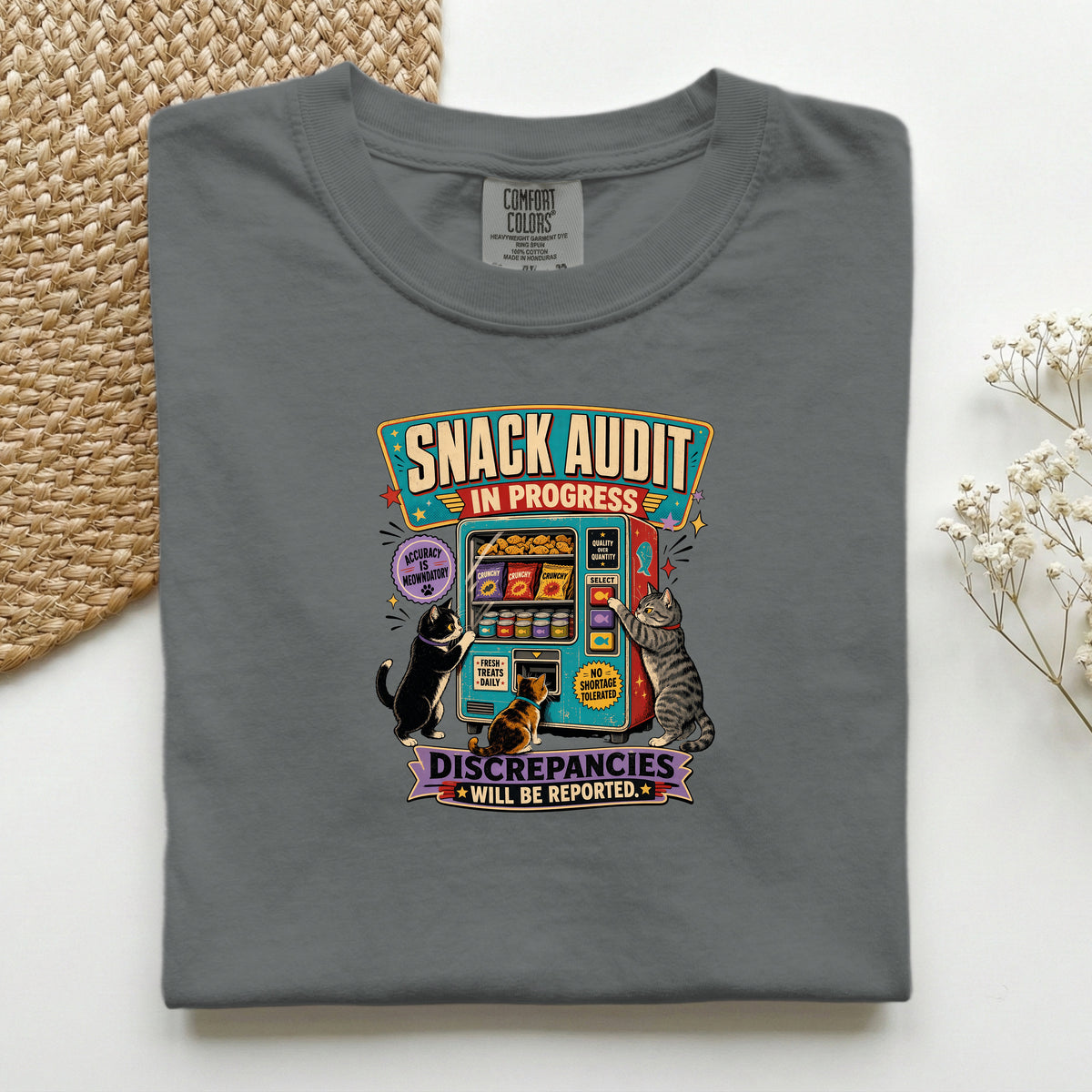 Snack Audit In Progress graphic tee in Pepper, folded mockup