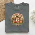 The Biscuit Factory Never Closes graphic tee in Pepper, folded mockup
