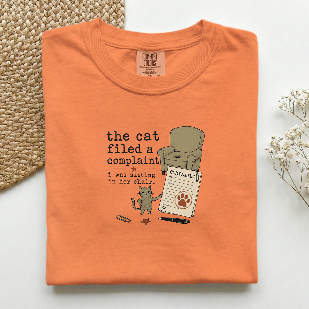 The Cat Filed A Complaint graphic tee in Burnt Orange, folded mockup