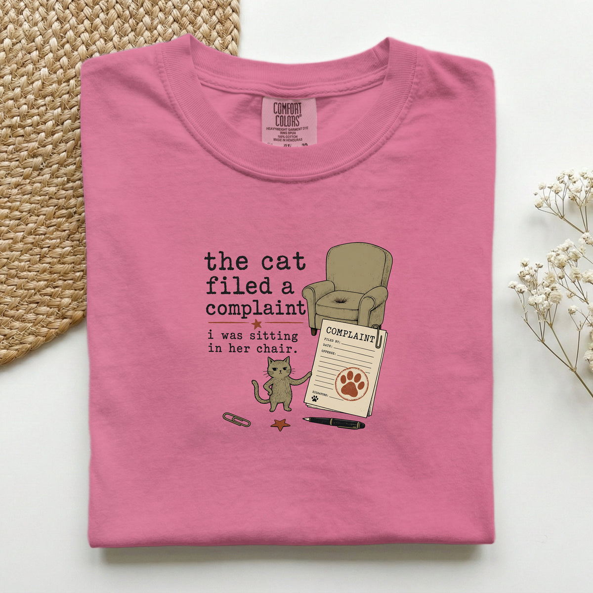 The Cat Filed A Complaint graphic tee in Crunchberry, folded mockup