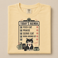 Today's Agenda Feed Cat graphic tee in Butter, folded flat lay