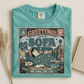 Greetings From My Sofa graphic tee in Seafoam, folded flat lay