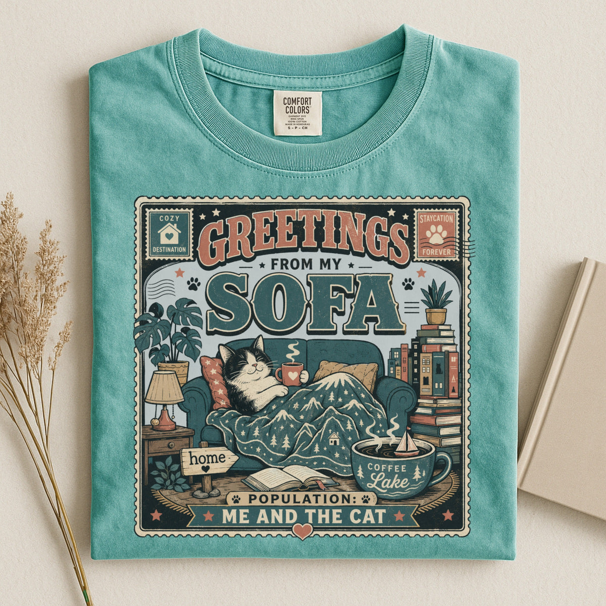 Greetings From My Sofa graphic tee in Seafoam, folded flat lay