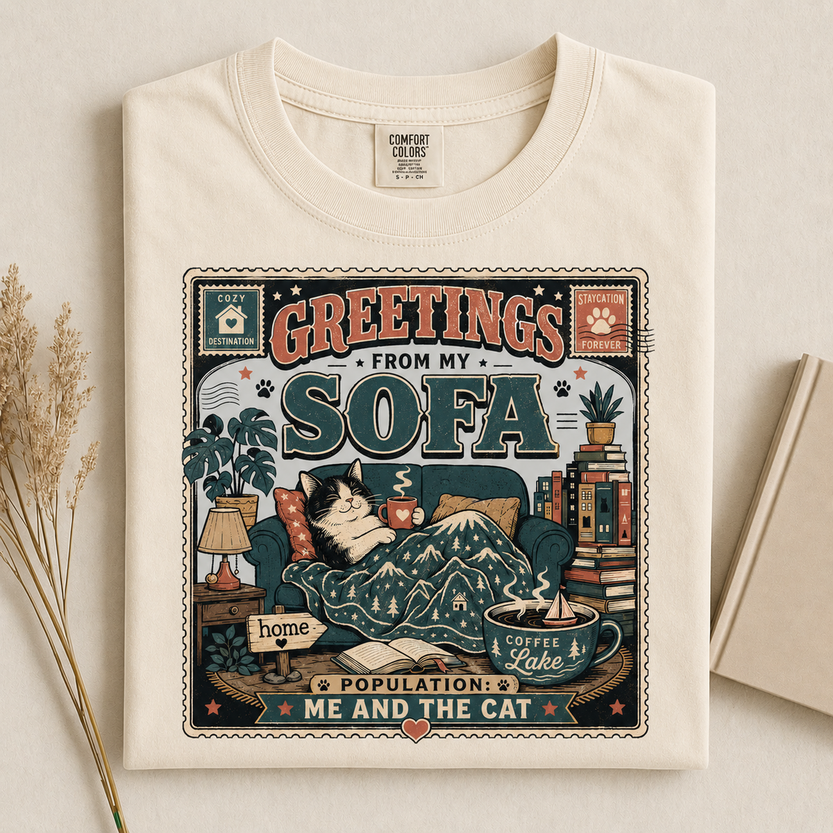 Greetings From My Sofa graphic tee in Ivory, folded flat lay
