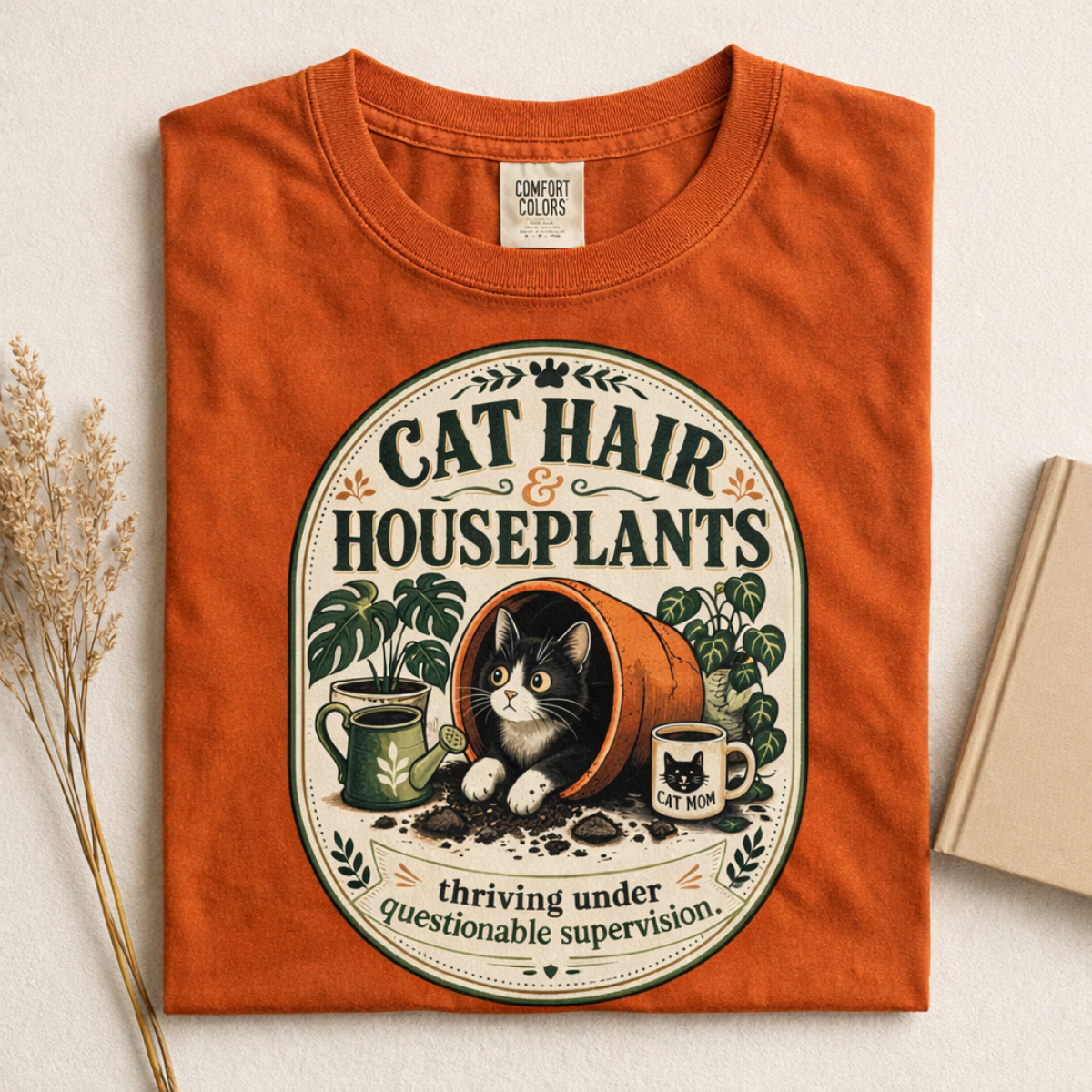Cat Hair & Houseplants graphic tee in Burnt Orange, folded flat lay