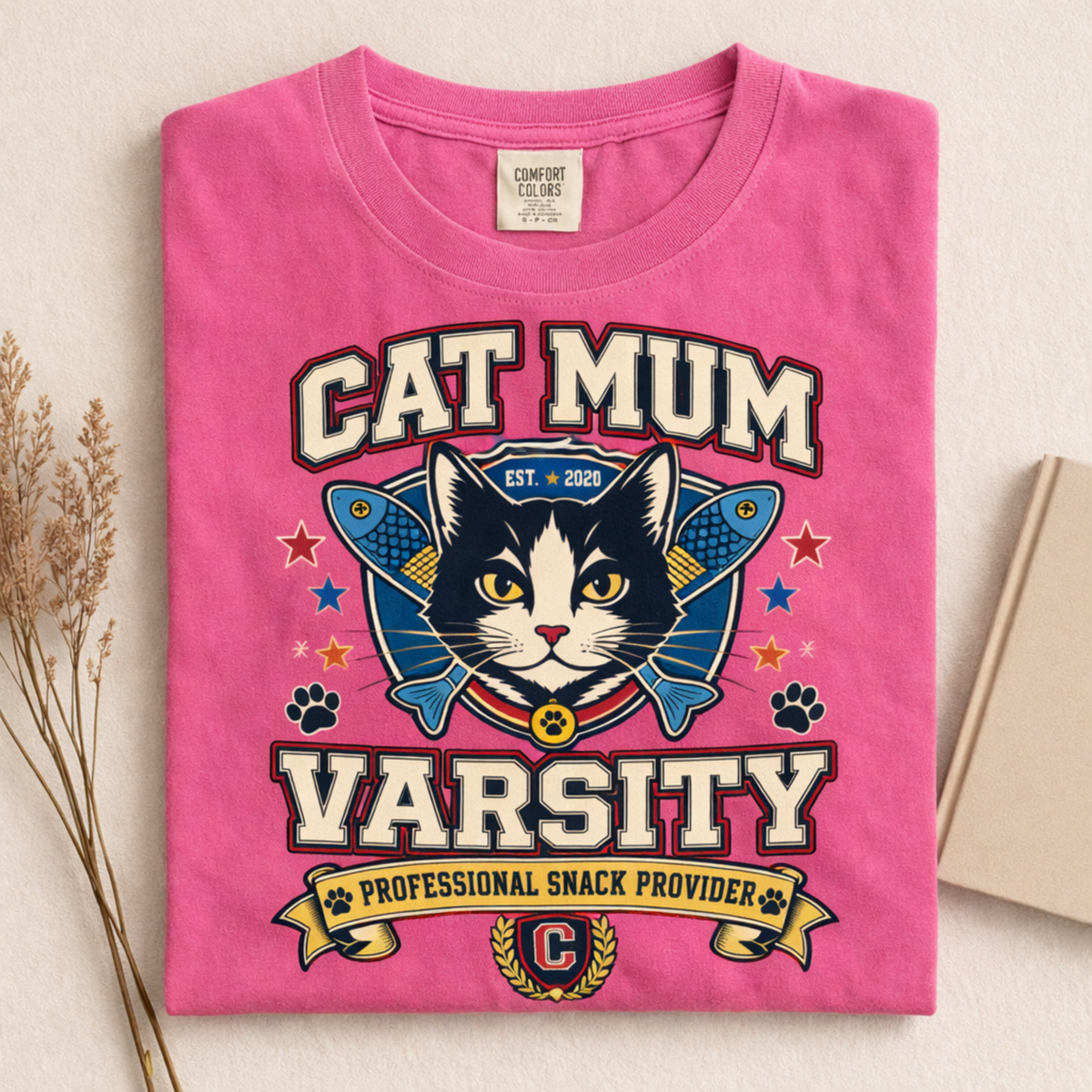 Cat Mum Varsity graphic tee in Crunchberry, folded flat lay