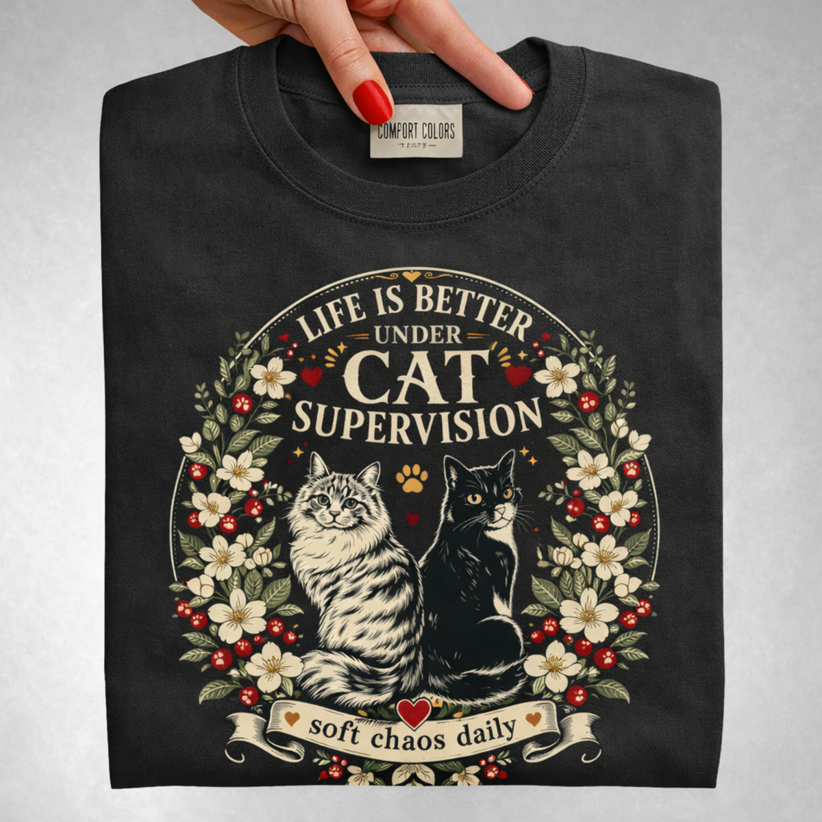 Life Is Better Under Cat Supervision graphic tee in Black, folded flat lay