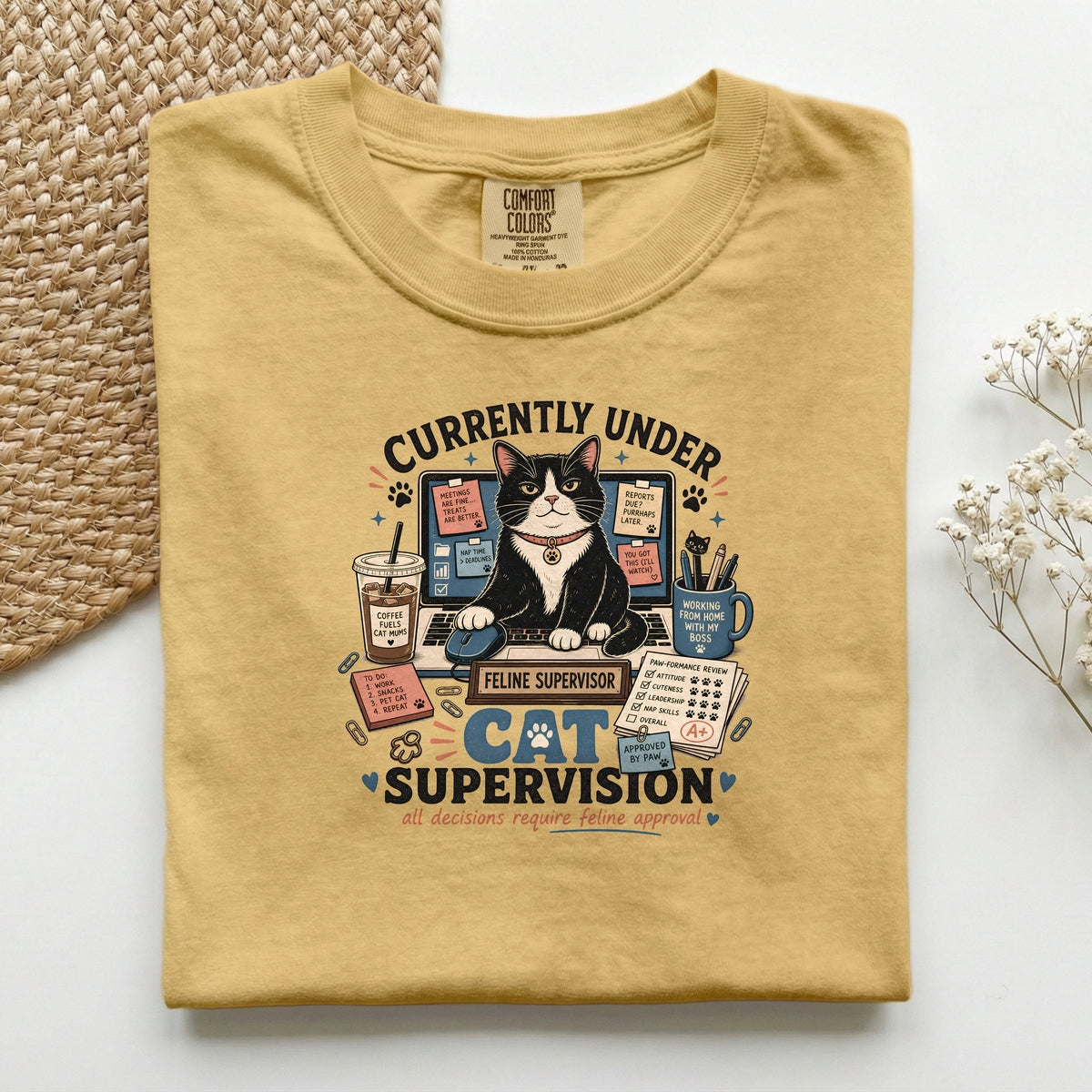 Currently Under Cat Supervision graphic tee in Mustard, folded flat lay