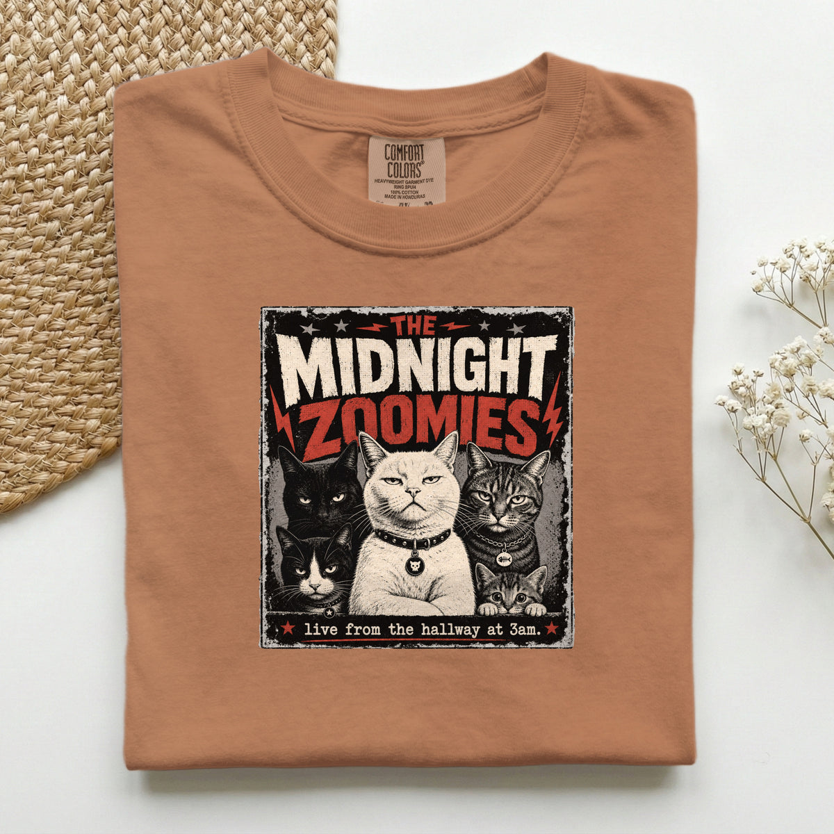 The Midnight Zoomies graphic tee in Burnt Orange, folded flat lay