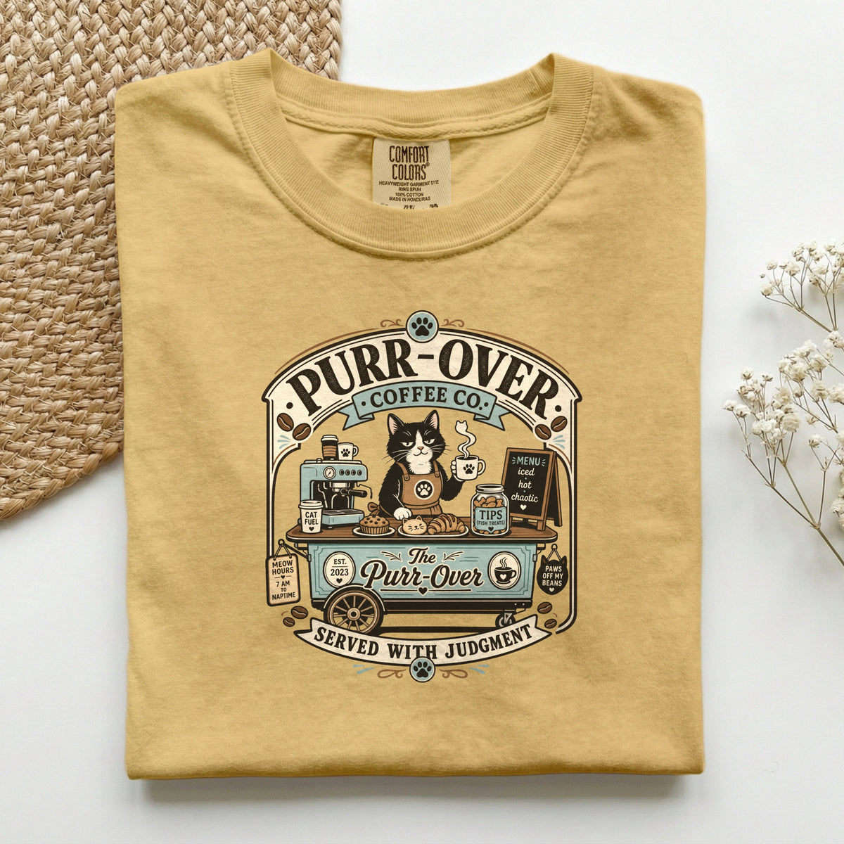 Purr-Over Coffee Co. graphic tee in Mustard, folded flat lay