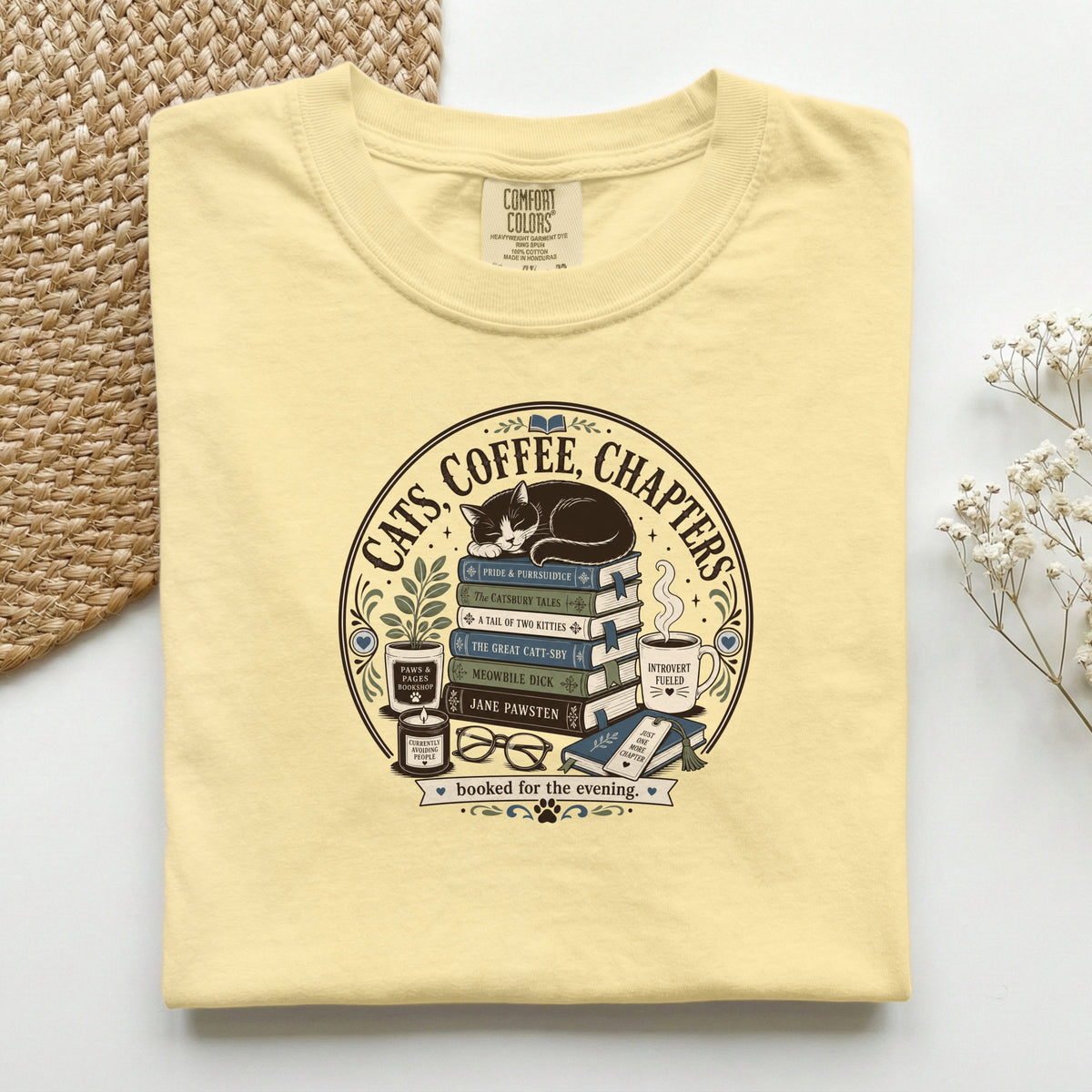 Cats Coffee Chapters graphic tee in Butter, folded flat lay