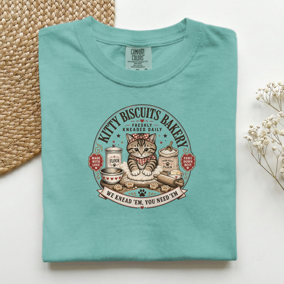 Kitty Biscuits Bakery graphic tee in Seafoam, folded flat lay