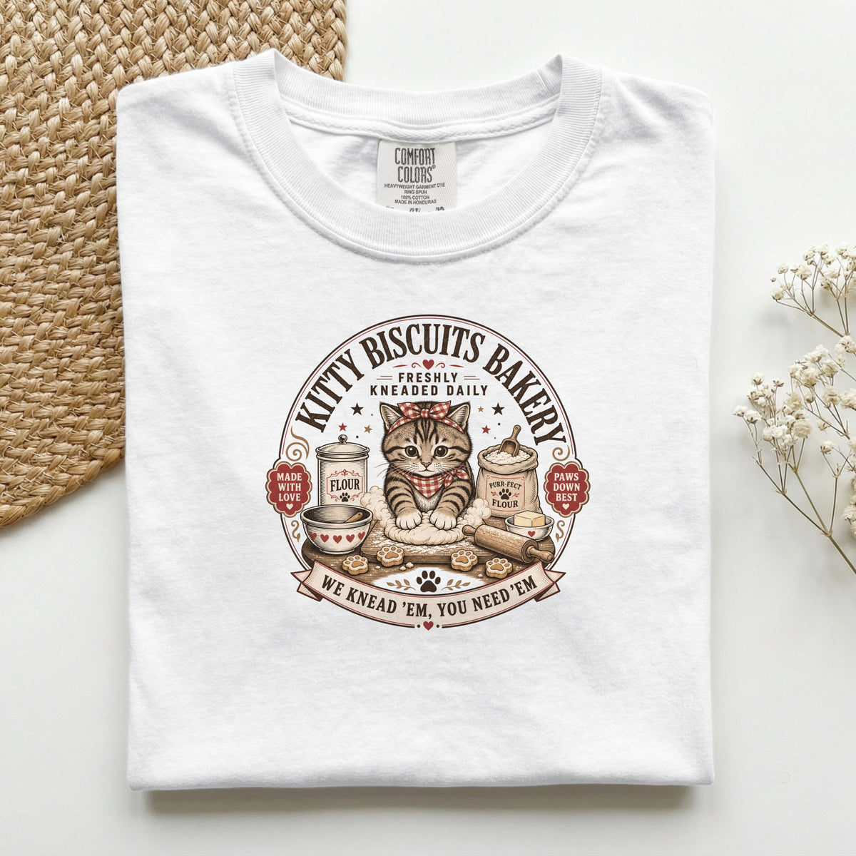 Kitty Biscuits Bakery graphic tee in White, folded flat lay
