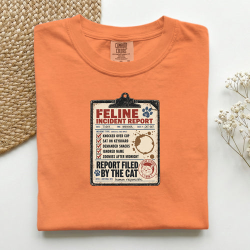 Feline Incident Report graphic tee in Red, folded flat lay