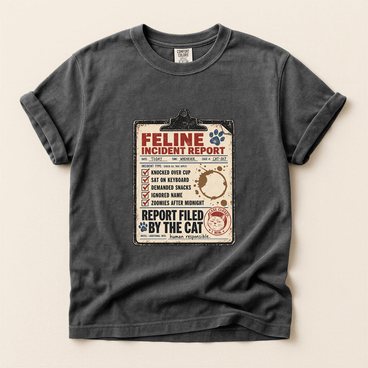 Feline Incident Report graphic tee in Crunchberry, folded flat lay