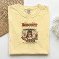The Biscuit Maker's Handbook graphic tee in Butter, folded flat lay