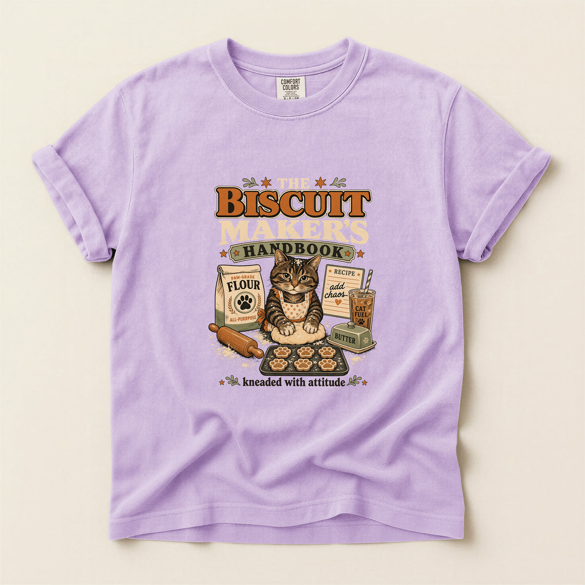 The Biscuit Maker's Handbook graphic tee in Orchid, folded flat lay