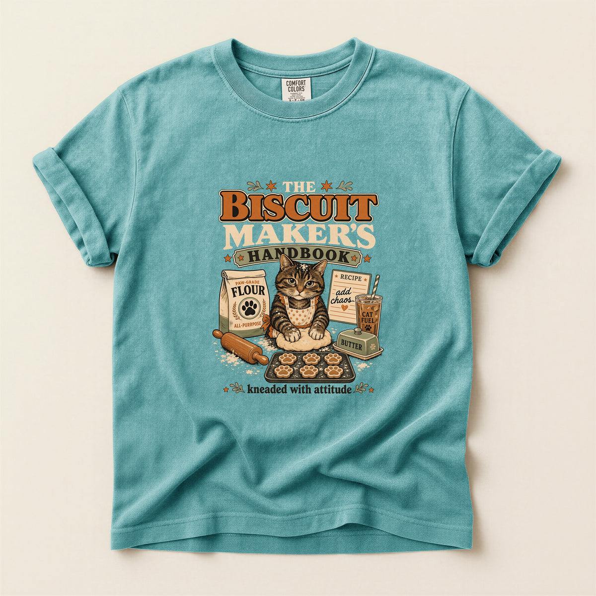 The Biscuit Maker's Handbook graphic tee in Seafoam, folded flat lay