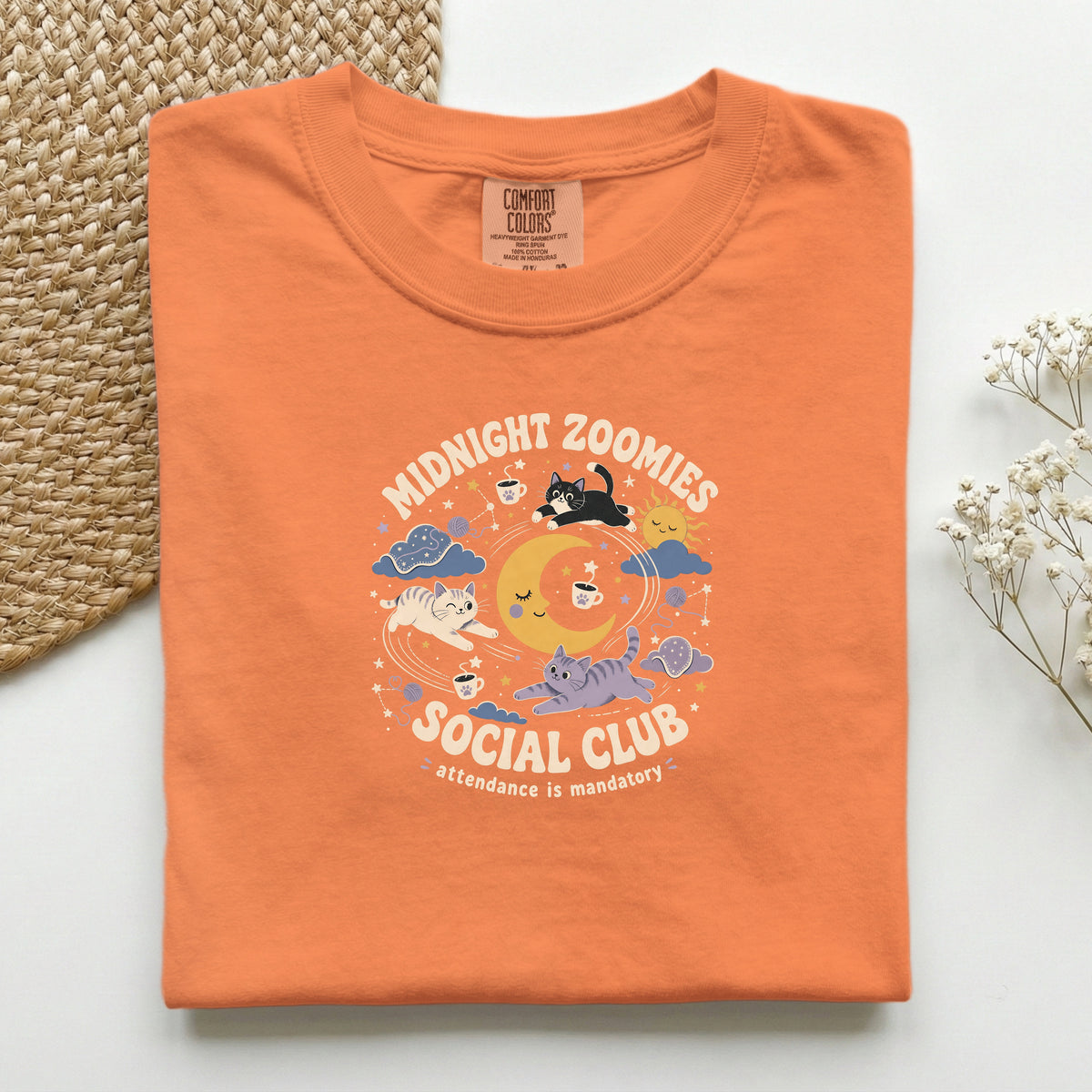 Midnight Zoomies Social Club graphic tee in Burnt Orange, folded flat lay