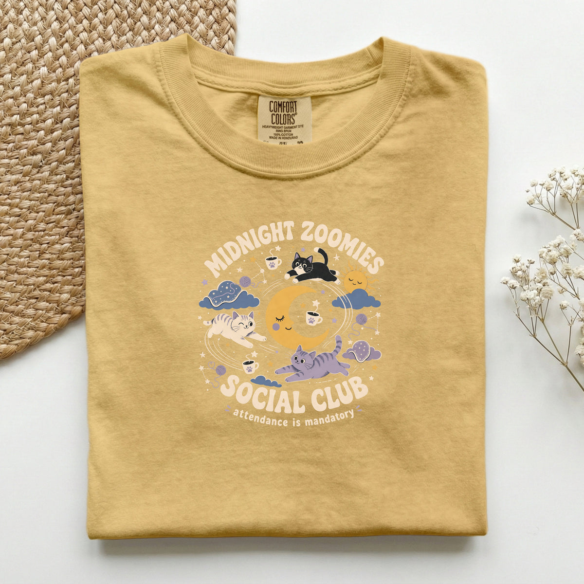 Midnight Zoomies Social Club graphic tee in Mustard, folded flat lay