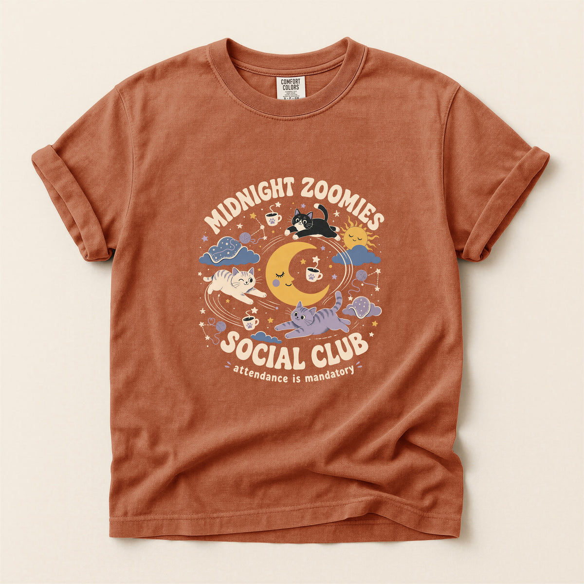 Midnight Zoomies Social Club graphic tee in Yam, folded flat lay