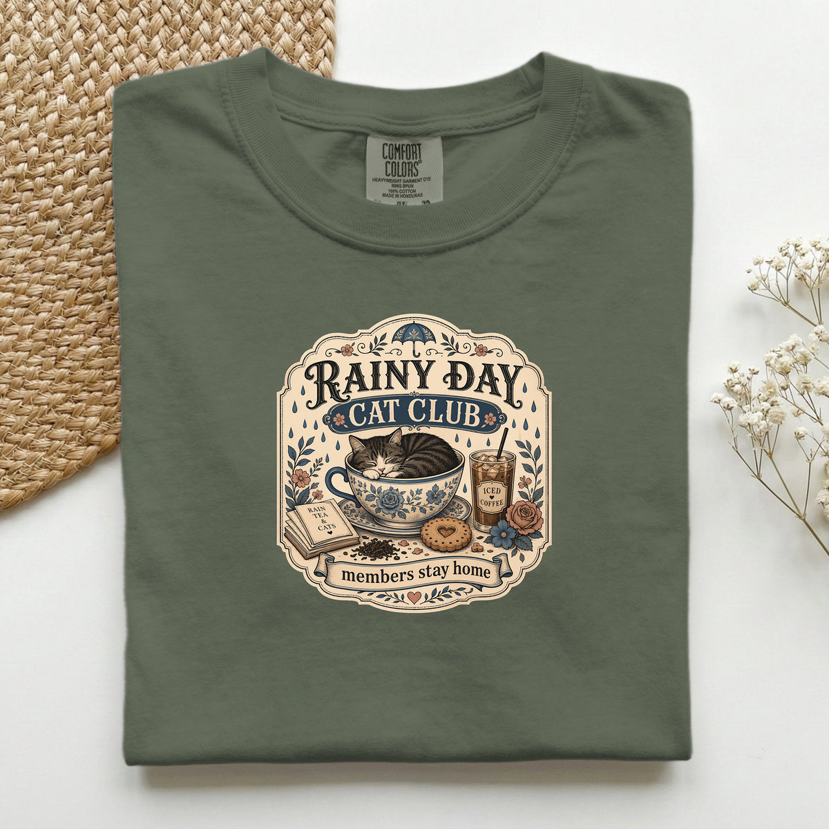 Rainy Day Cat Club graphic tee in Sage, folded flat lay