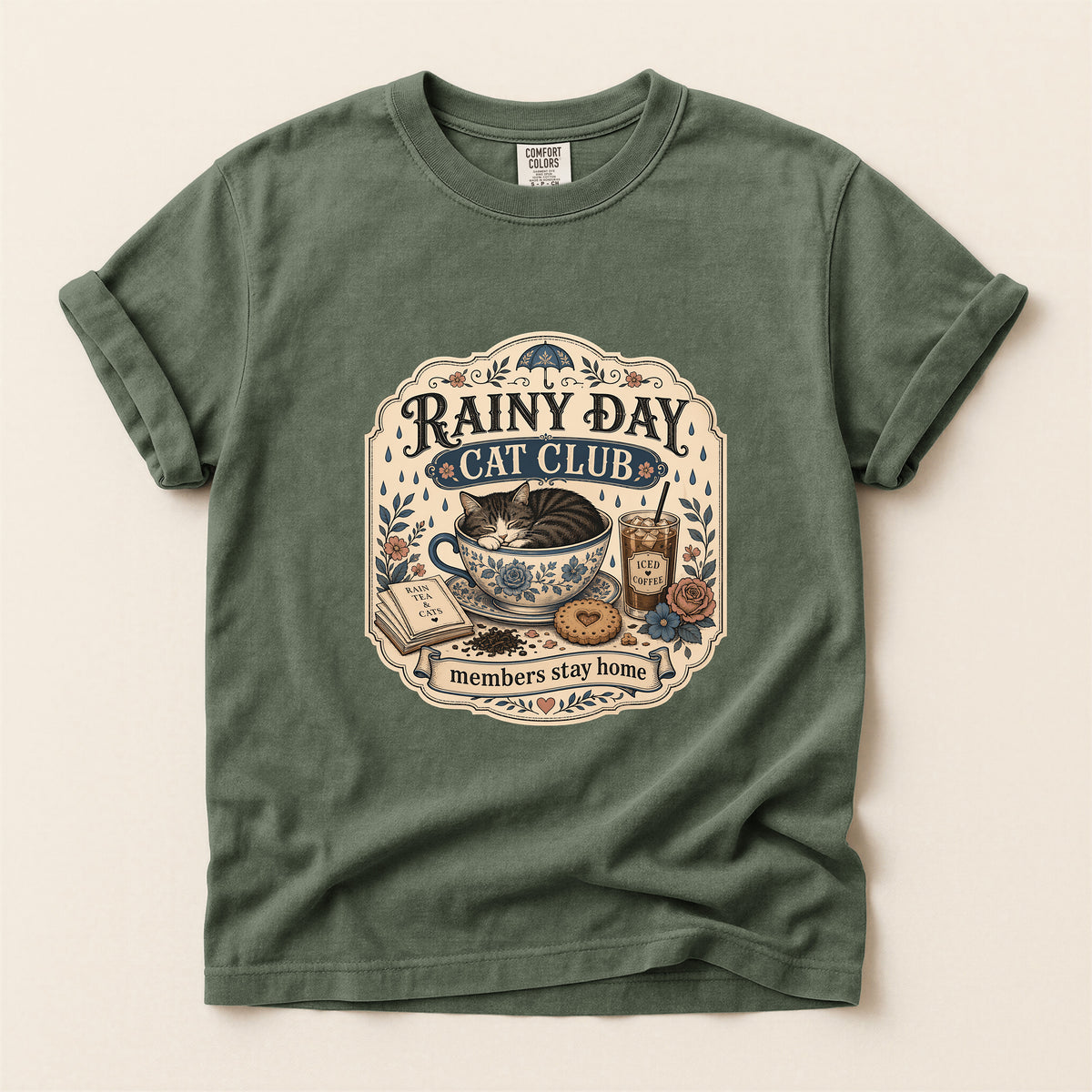 Rainy Day Cat Club graphic tee in Moss, folded flat lay