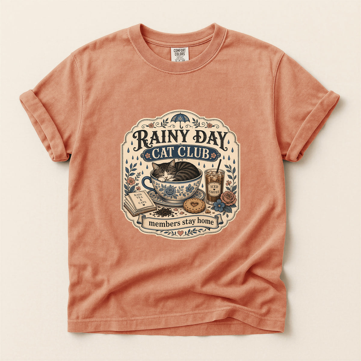 Rainy Day Cat Club graphic tee in Terracotta, folded flat lay