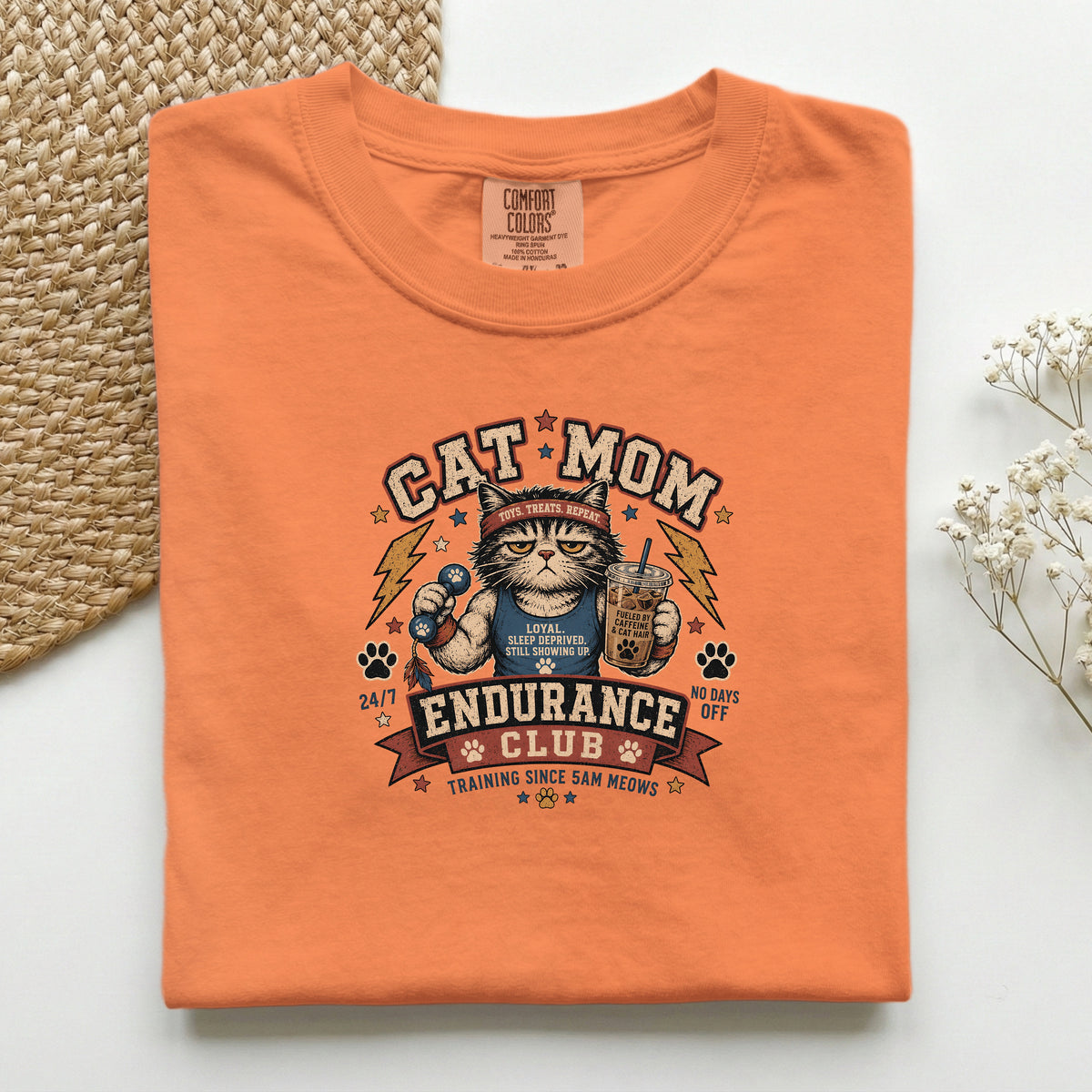 Cat Mom Endurance Club graphic tee in Burnt Orange, folded flat lay