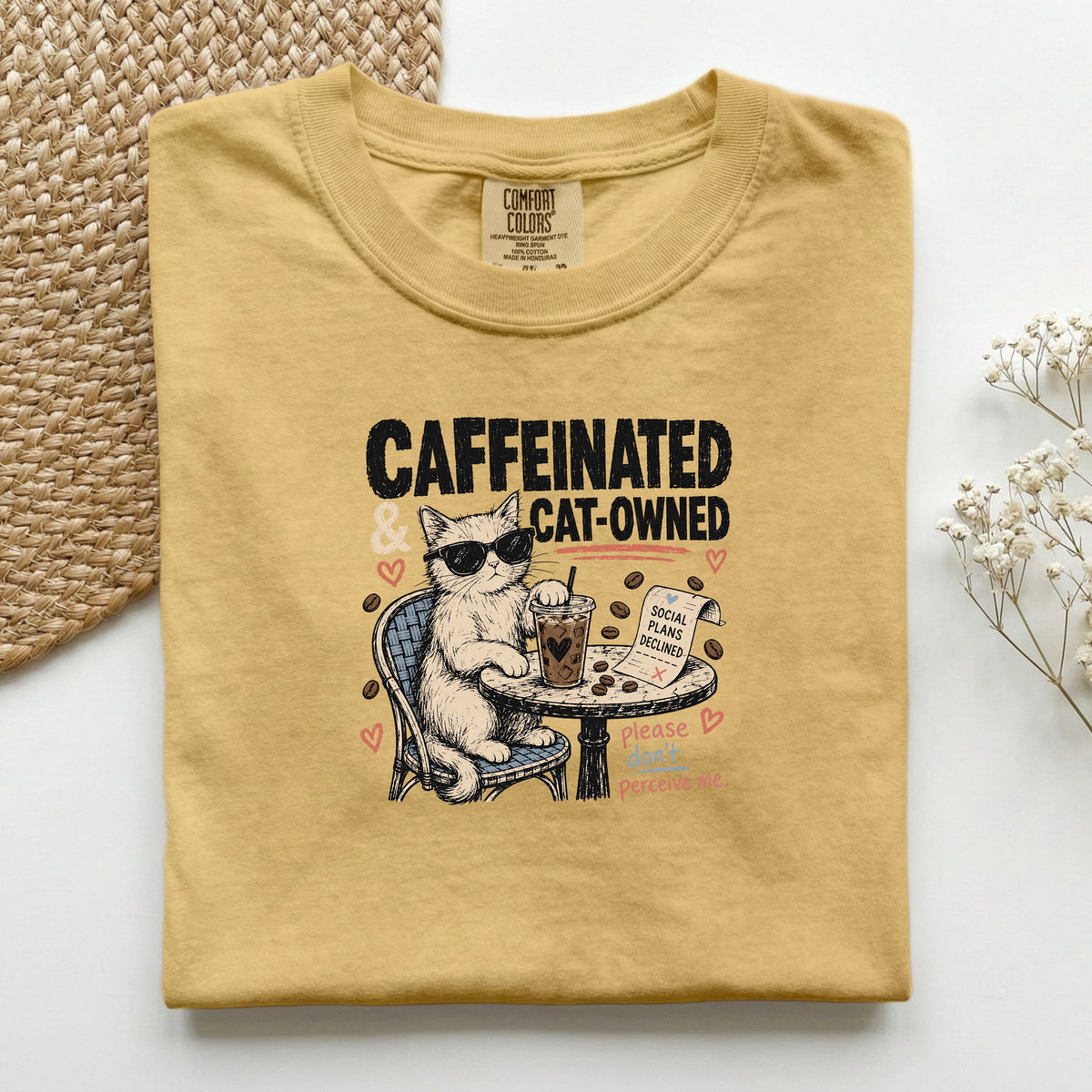 Caffeinated and Cat Owned graphic tee in Mustard, folded flat lay