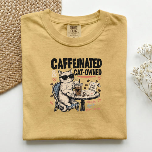 Caffeinated and Cat Owned graphic tee in Mustard, folded flat lay