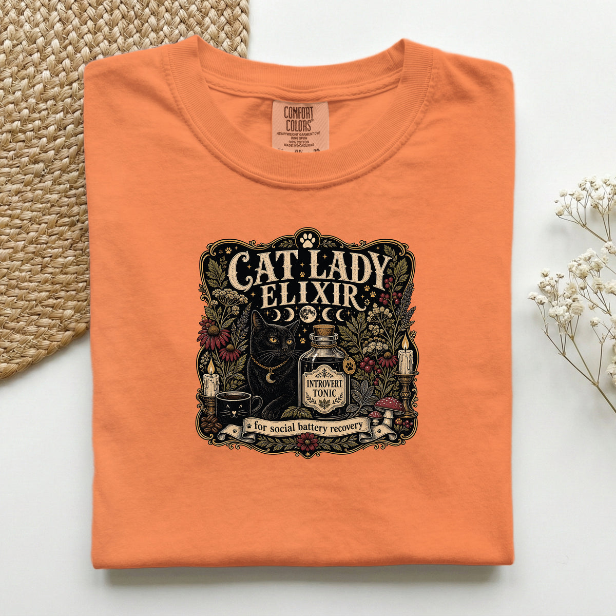 Cat Lady Elixir graphic tee in Burnt Orange, folded flat lay