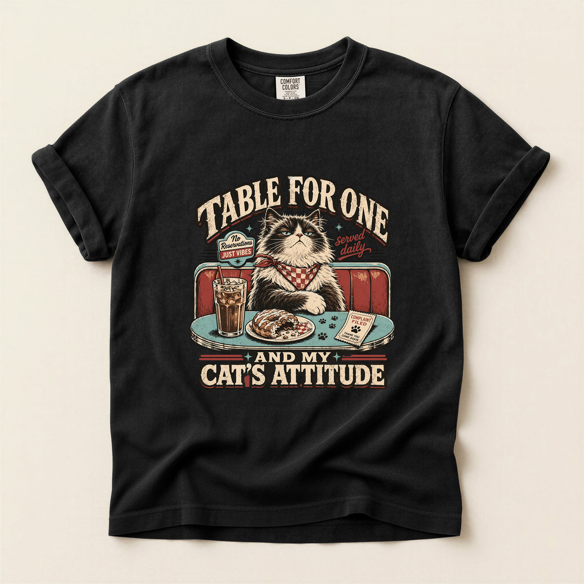 Table For One graphic tee in Black, folded flat lay