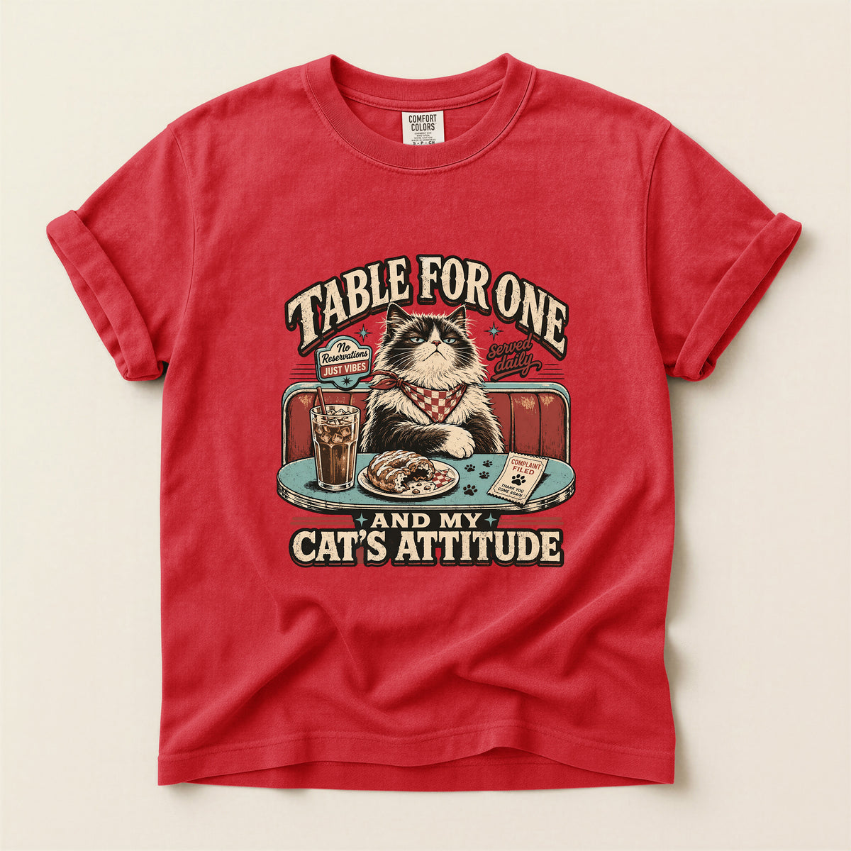 Table For One graphic tee in Red, folded flat lay