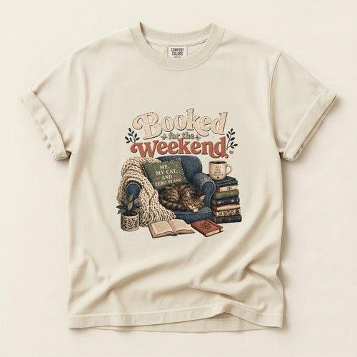 Booked By My Cat graphic tee in Ivory, folded flat lay