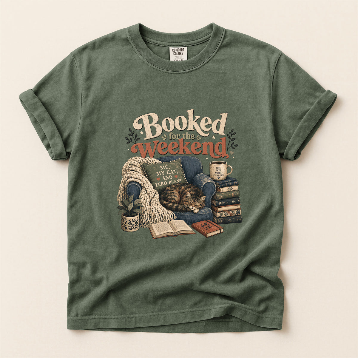 Booked By My Cat graphic tee in Moss, folded flat lay