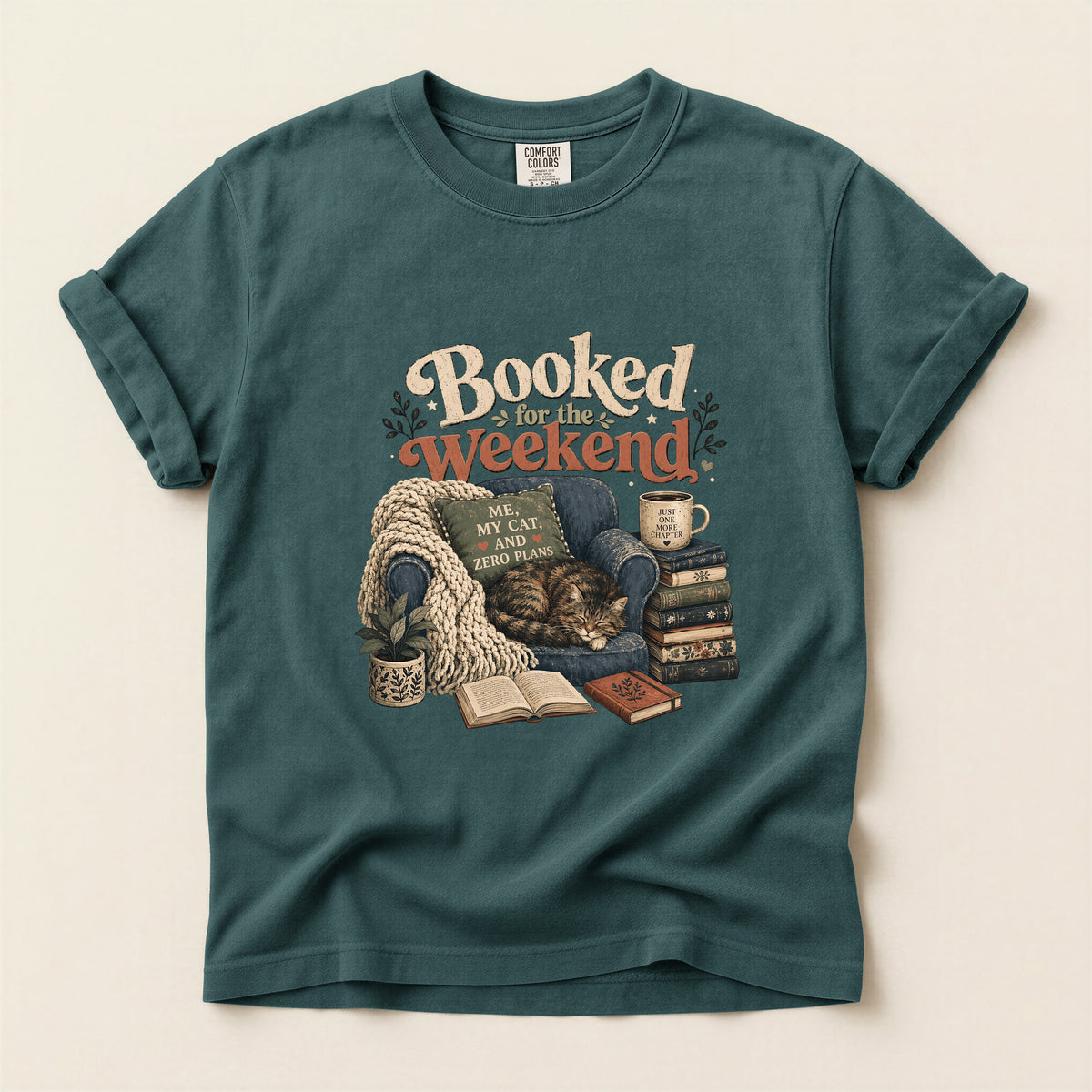 Booked By My Cat graphic tee in Blue Spruce, folded flat lay