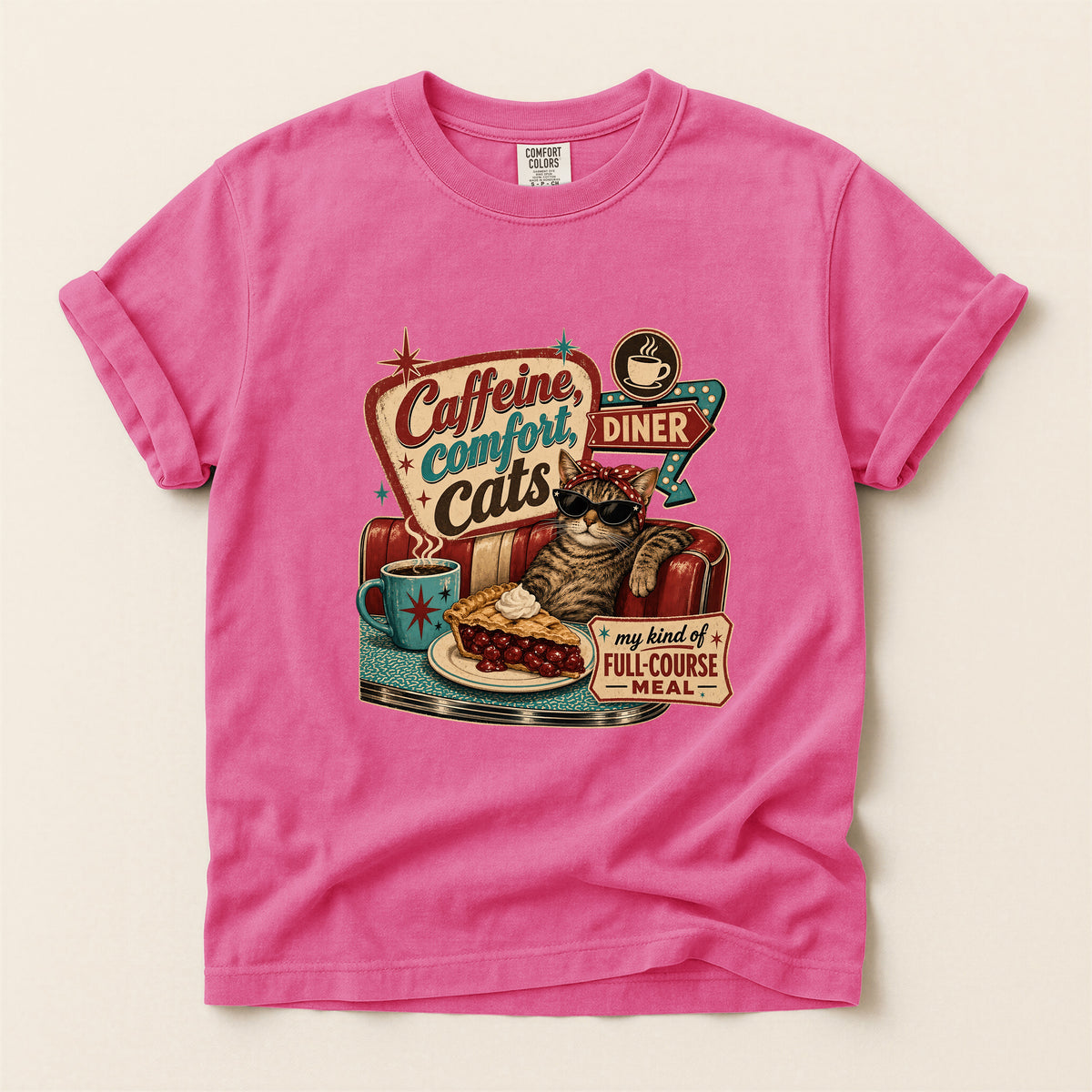 Caffeine Comfort Cats graphic tee in Crunchberry, folded flat lay
