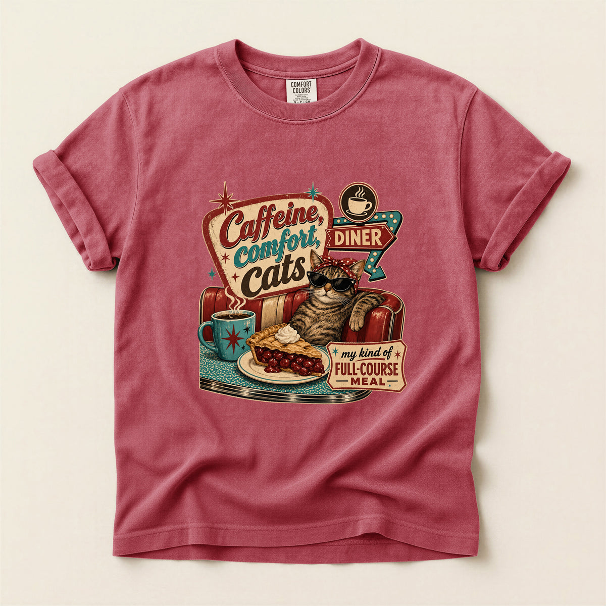 Caffeine Comfort Cats graphic tee in Crimson, folded flat lay