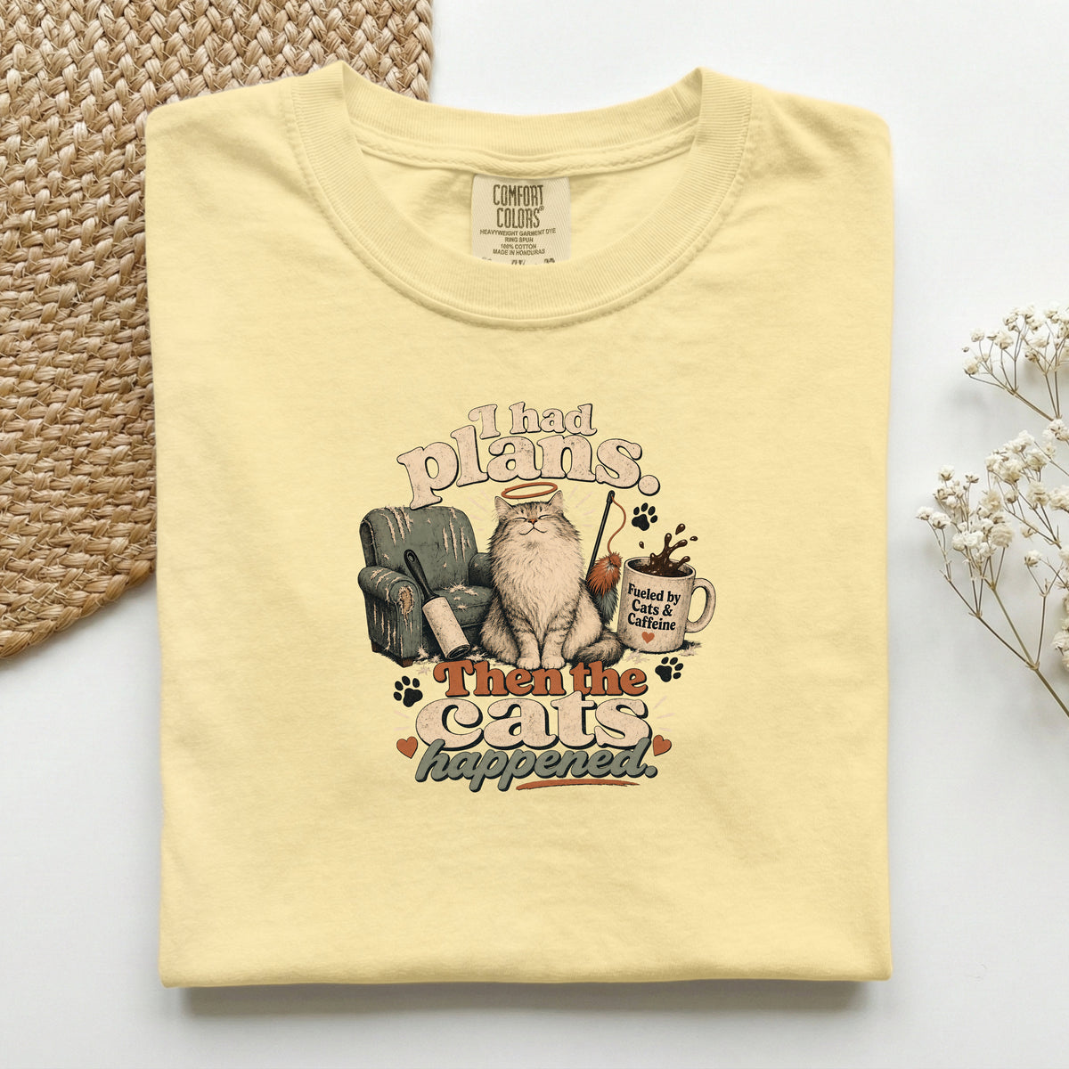 I Had Plans Then The Cats Happened graphic tee in Butter, folded flat lay