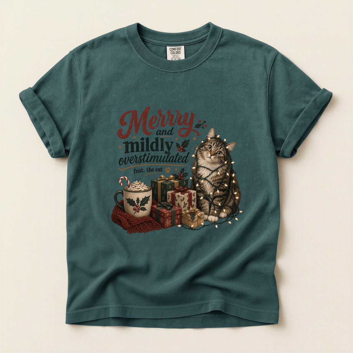Merry and Mildly Overstimulated graphic tee in Blue Spruce, folded flat lay