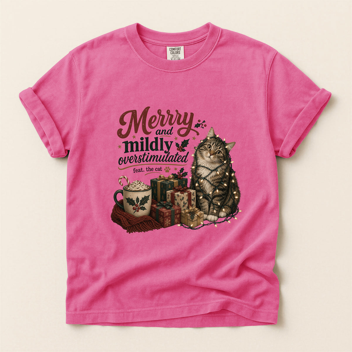 Merry and Mildly Overstimulated graphic tee in Crunchberry, folded flat lay