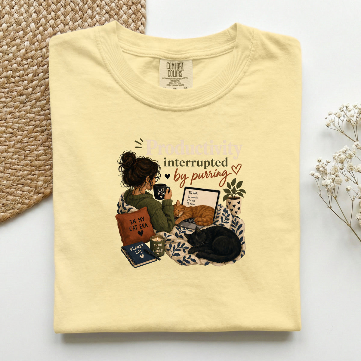 Productivity Interrupted graphic tee in Butter, folded flat lay