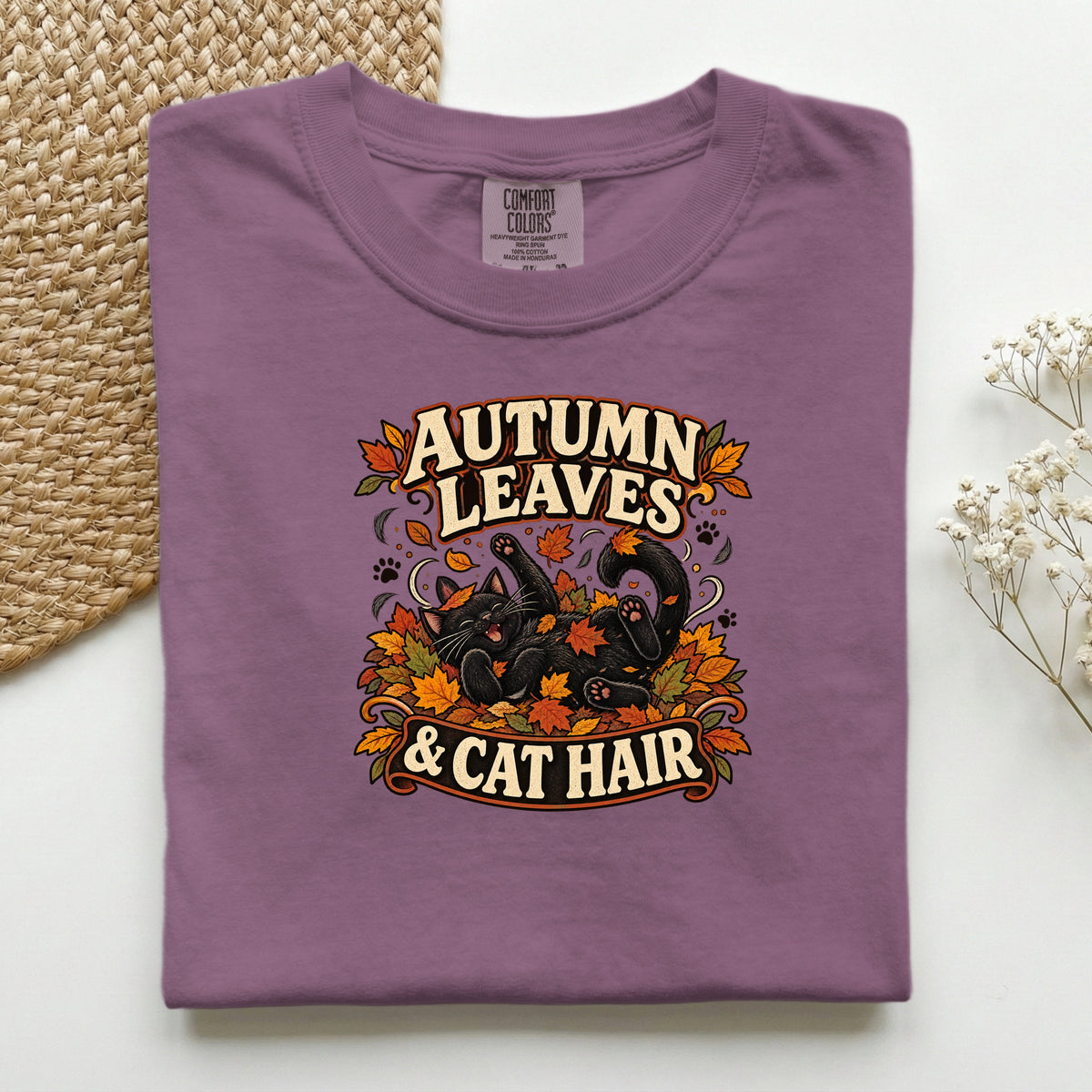 Autumn Leaves & Cat Hair graphic tee in Berry, folded flat lay